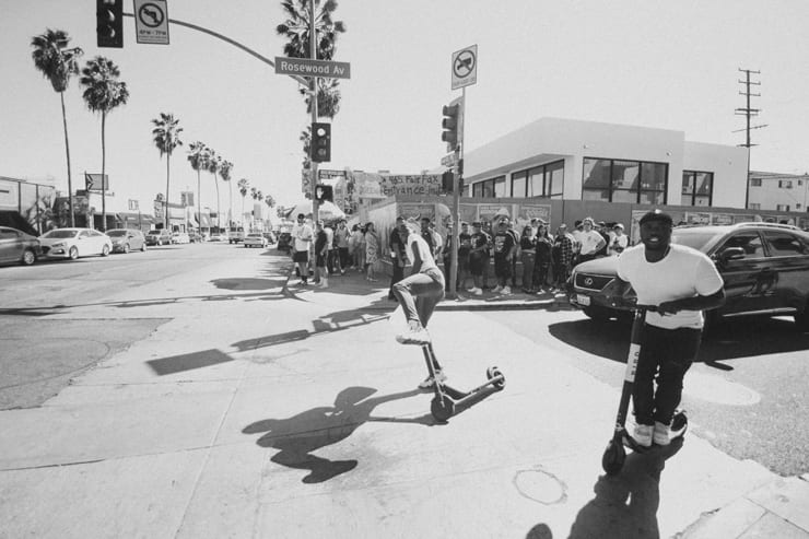 group in LA on scooters in traffic