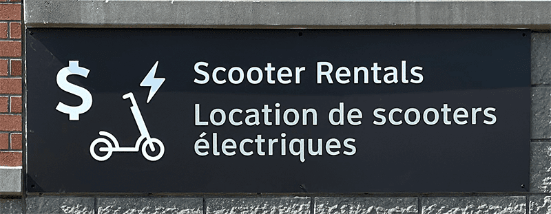 canadian micromobility scooter rentals sign at GO Transit station in Ontario