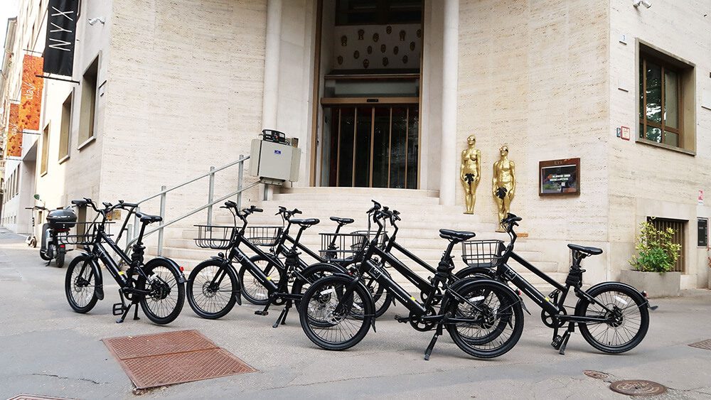 e-bikes in front of a hotel in Milan
